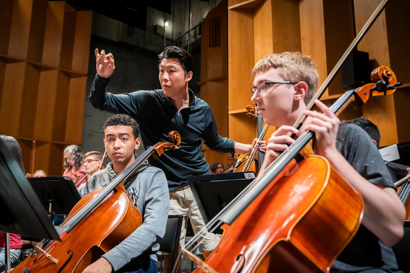 NYO2 students being coached by faculty