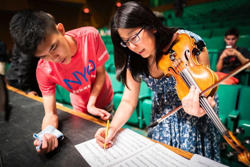 NYO2 students being coached by faculty