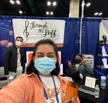 A selfie of several masked people working a Through the Staff tabling event.