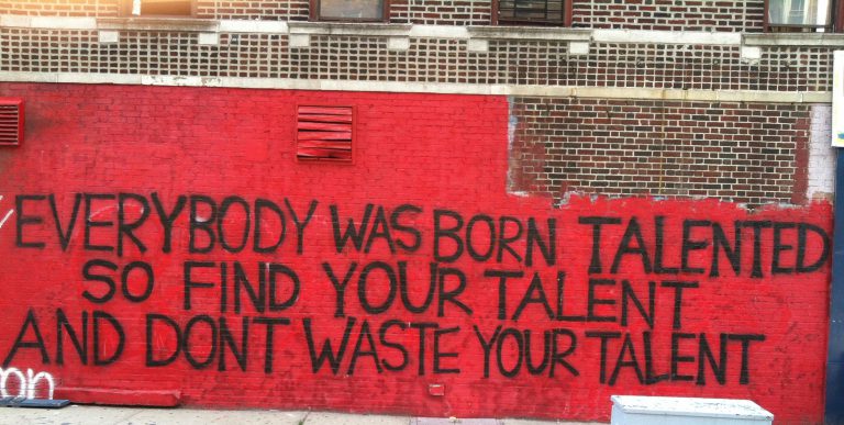 Everybody was born talented so find your talent and don't waste your talent. A sign in red.